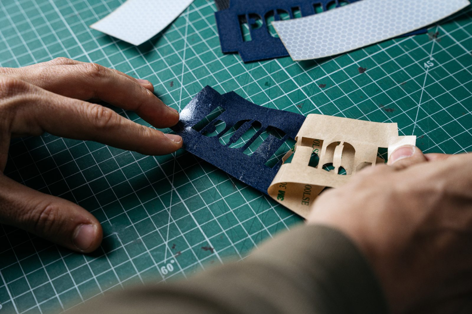 Removing a laser-cut patch from the sheet